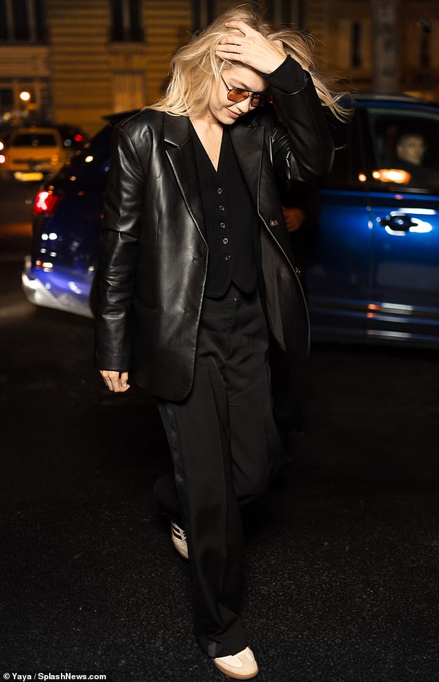 Here she goes: The 28-year-old supermodel emphasized her lithe frame by donning a slimming, form-fitting black leather jacket