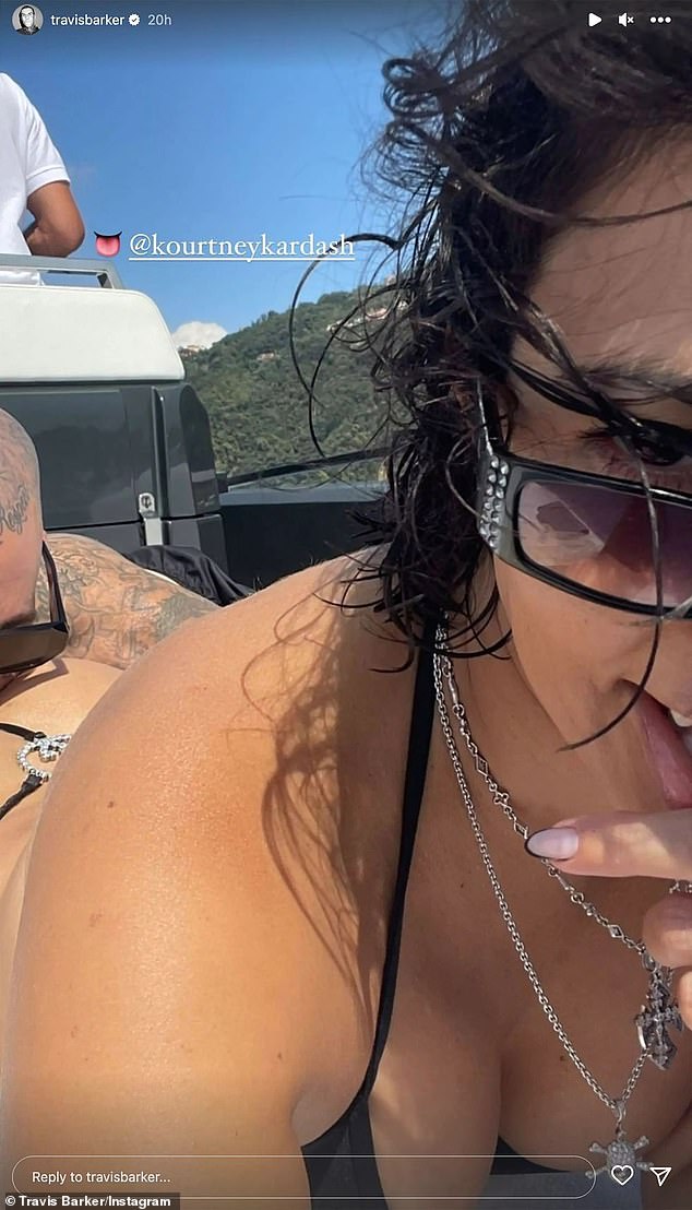 Everyone aboard the love boat!  Travis shared another racy photo of him poking his nose into Kourtney's backside as she lay on a boat in her bikini