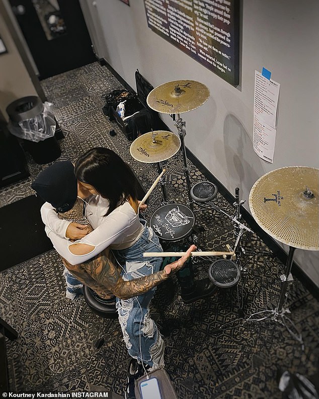 Music lovers!  Kourtney shared this loved-up photo of her straddling Travis as he practiced his drumming last year