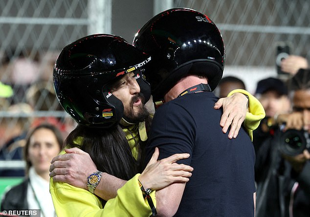 Back up again!  Gordon gave DJ Steve Aoki a friendly hug after the race