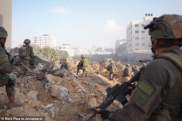 Israeli troops are seen amid the rubble in Gaza carrying out attacks on the enemy