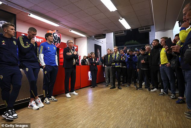 Sweden manager Janne Anderson (centre) spoke to the media shortly after the match was abandoned