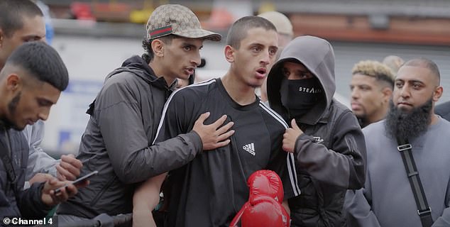 One fighter gives a team talk during a fight at the King of the Ring fight club in Manchester