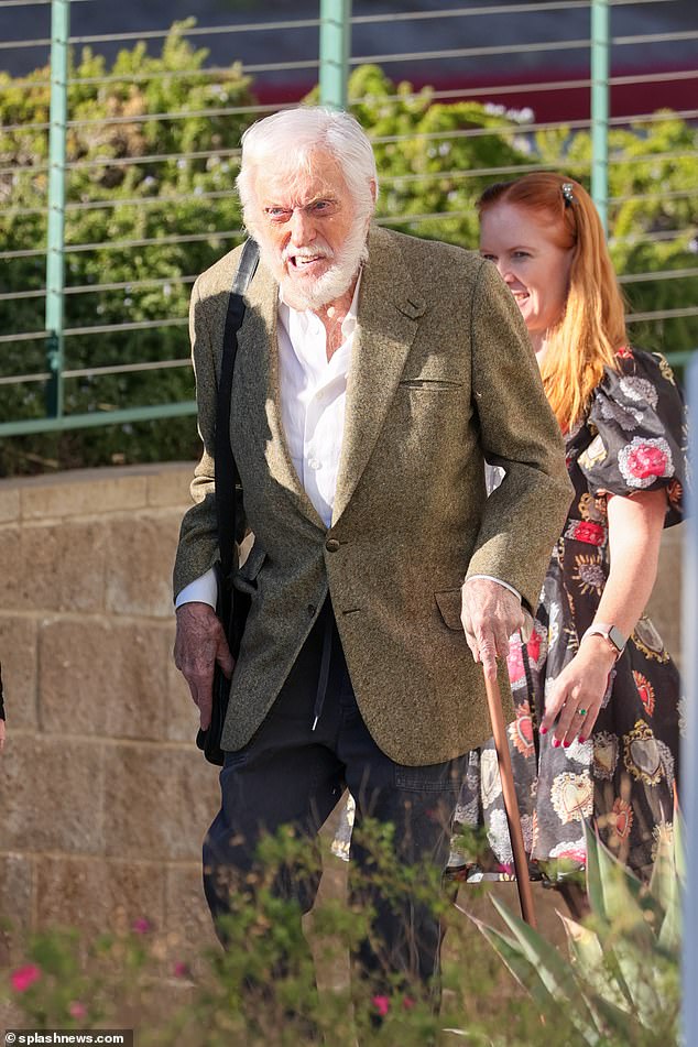 Looking good: Sporting a full beard and mustache, the iconic Mary Poppins star looked great wearing a tweed blazer with black trousers, a white shirt, black trousers and matching sneakers