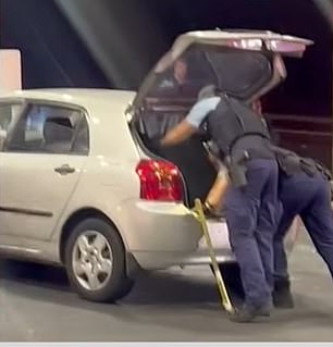 Police officers searched a hatchback and recovered several hockey sticks from the trunk