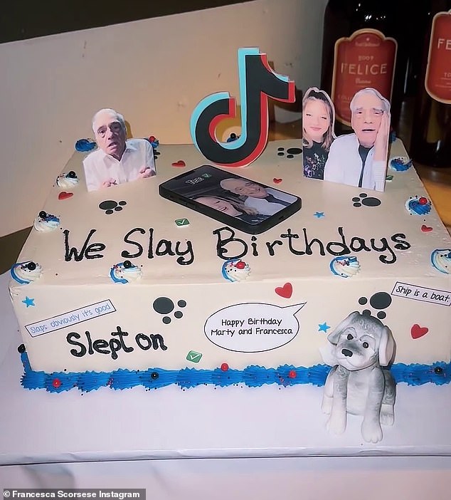 The cake had a ring of blue icing around the bottom, as well as a figurine of a small dog