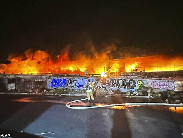 The fire spread to a second pallet site and forced people to flee from a nearby homeless camp