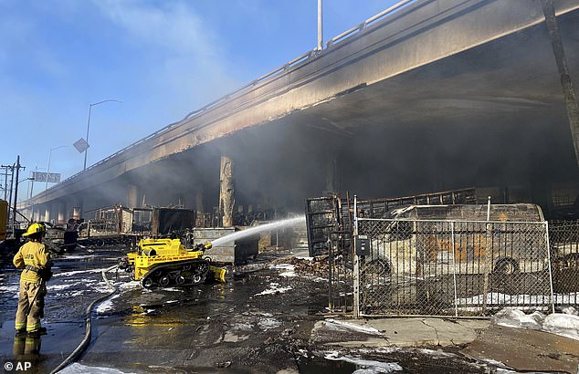 Crews are working to extinguish the fire under Interstate 10 and begin repairing damage