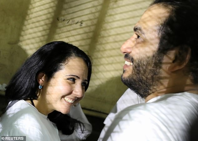 Hijazi and her husband Mohamed Hassanein, pictured shortly after being acquitted of human trafficking charges in Egypt