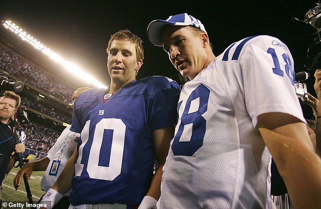 Eli Manning (left) and Peyton Manning (right) are seen after the first of three NFL meetings