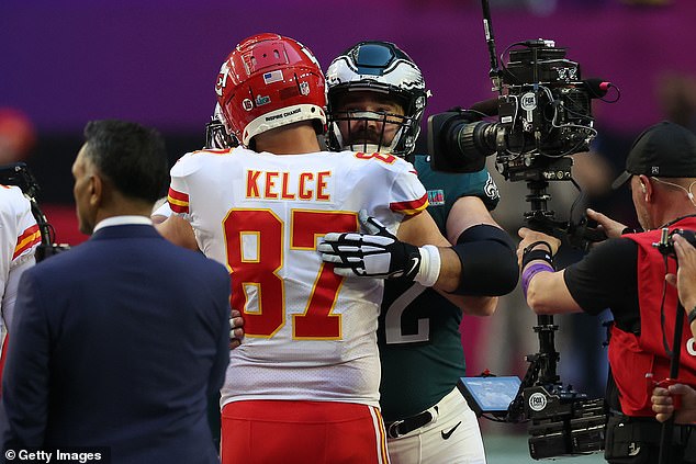 Chiefs sign tight end Travis Kelce and Eagles center Jason Kelce embrace before Super Bowl LVII