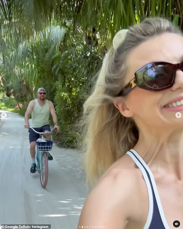 Relaxing: She also shared a sweet video of the pair on a morning bike ride around the island together, with Georgia beaming as she filmed her boyfriend cycling behind her