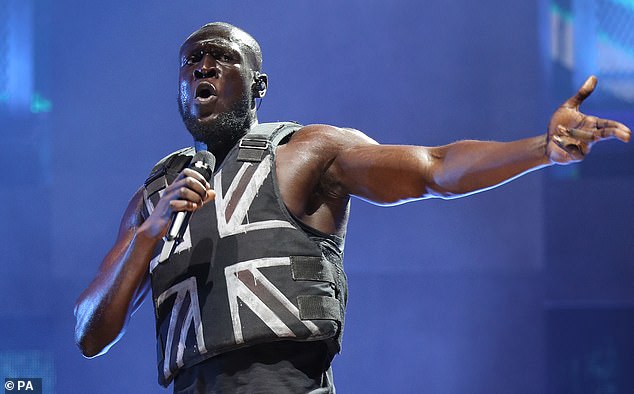 Pictured Stormzy at the Glastonbury Festival.  He later revealed that his in-ear monitors broke down 20 minutes into his headline performance at the Glastonbury Festival, making it the 