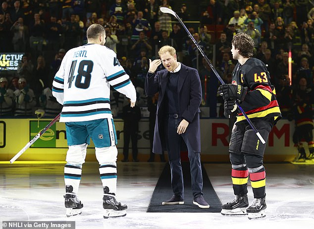 Harry joked with the players after walking onto the ice ahead of the game at Rogers Arena