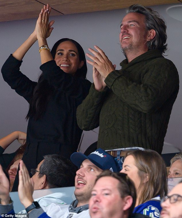 Meghan Markle celebrates during the NHL game in Canada - a country that is very important to her and Harry because it is the place where they started having sex.  Her boyfriend Markus Anderson is with her.  He was the man who organized the Sussexes' first date