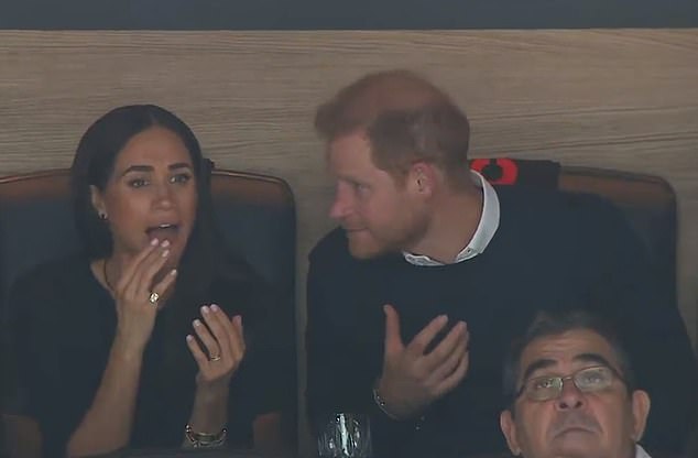 The Duke of Sussex was seen at one point explaining what had happened in the game when his wife appeared confused