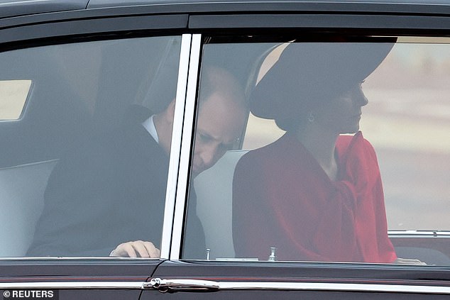 Kate Middleton looked chic in a red Catherine Walker coat dress as she met the President of South Korea with her husband Prince William today