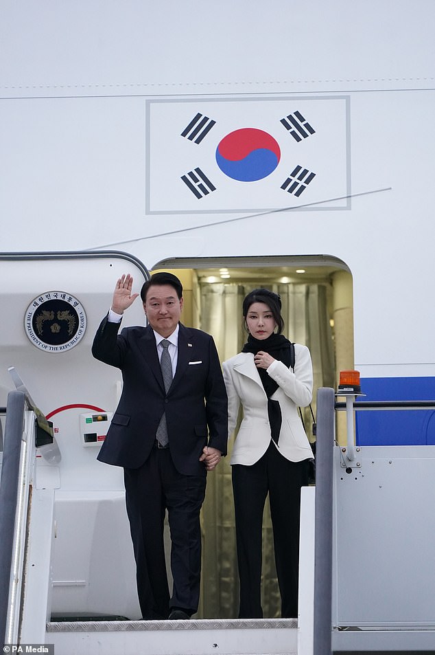 Mr Yoon and Ms Kim arrive at Stansted Airport (PA) on Monday