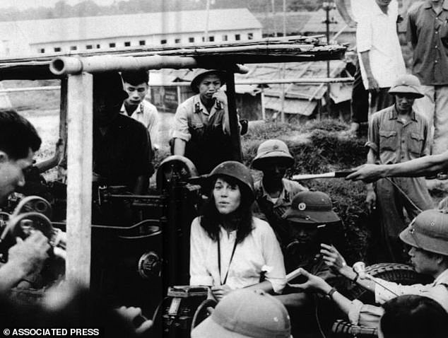 Jane Fonda sitting on an anti-aircraft gun in Vietnam in 1972. She has since apologized for offending the families of American veterans with the photo and her comments about the war