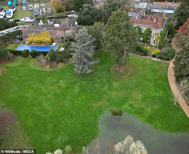 The well-kept garden is partly under water