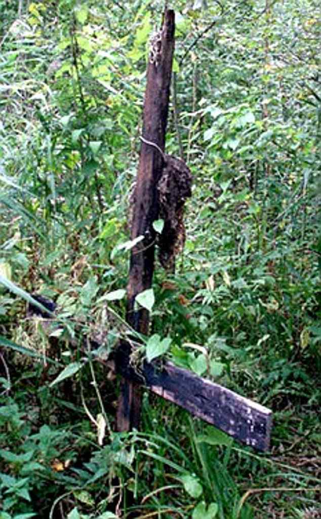 An inverted cross marks the spot where the four Russian teenagers were ritually slaughtered