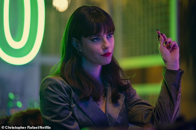 Glamour: In another photo, his co-star Kaya Scodelario looks fantastic in a dark blazer as he sports dark brown locks and heavy bangs