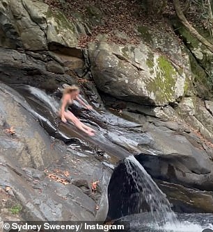 Amazingly, she seemed in good spirits as she let out a small scream before hitting the water