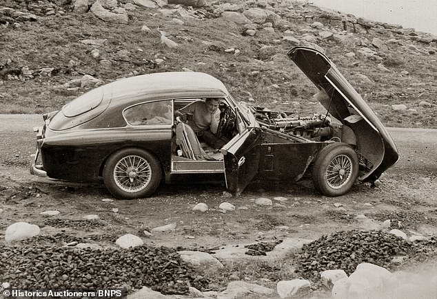 Another family photo of the beautiful Aston Martin, before it was placed in the family garage for storage