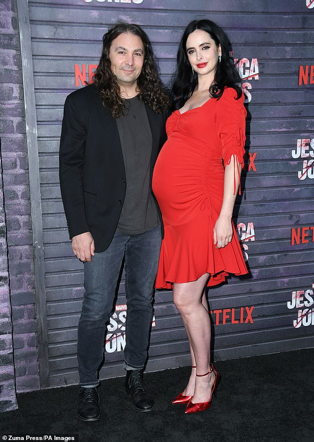 Longtime partners: Krysten and Adam have been together since 2014, and in 2019 the couple welcomed their first child together, their son Bruce (pictured in 2019)