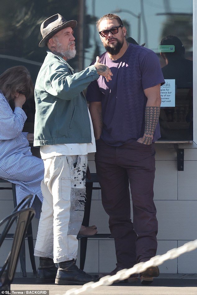 Chit chat: He listened to his friend while standing in the sun