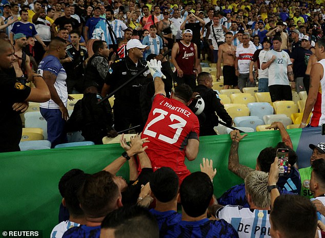 Argentinian goalkeeper Dibu Martinez jumped to the stands and tried to grab a stick