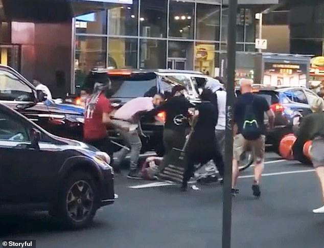 Video of the attack showed Borgen being left defenseless as he was kicked, punched and hit with crutches and flagpoles by a crowd of eight to 10 people