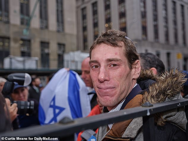 Borgen smiles after appearing in court.  The climate in which his attacker was convicted is even more politically charged than when he was beaten in the summer of 2021