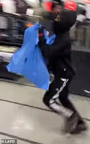 They ran around the store grabbing as much merchandise as they could carry