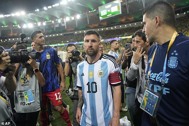 Lionel Messi led the Argentine players off the field, with the kick-off postponed due to violence