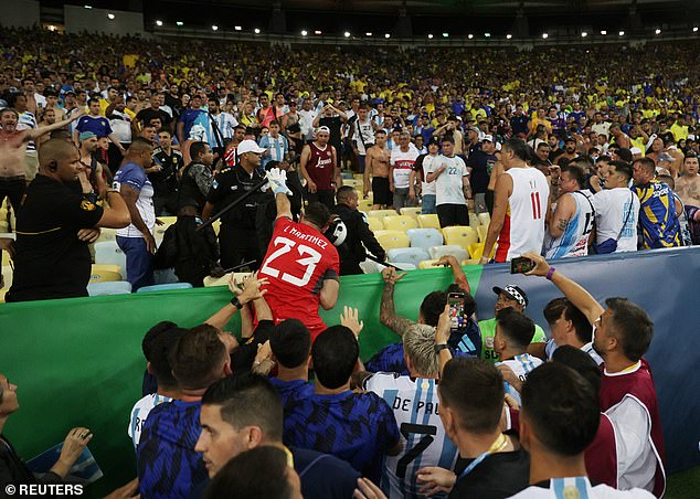 Argentina goalkeeper tried to jump into the stands as Brazilian police raided Argentina fans at the Maracana amid crowd trouble