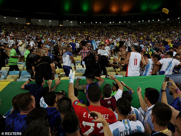 Martinez had to be restrained by his teammates as fights broke out in the stands