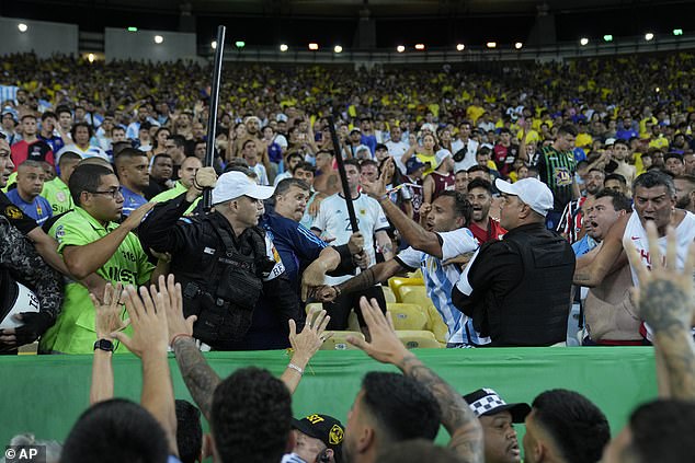 The confrontation between the two groups of fans quickly degenerated into chaos in the stands