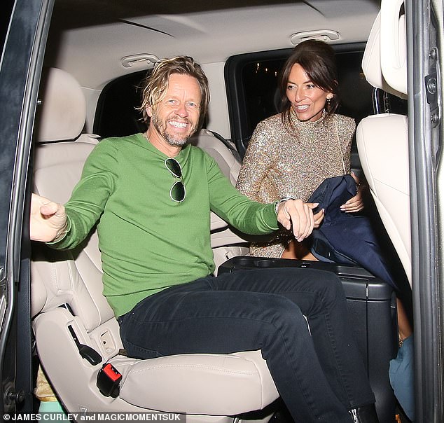 Two's company: She slipped into her car next to boyfriend Michael Douglas, 48, who cut a dapper figure in a navy blue blazer, paired with a green top and black trousers