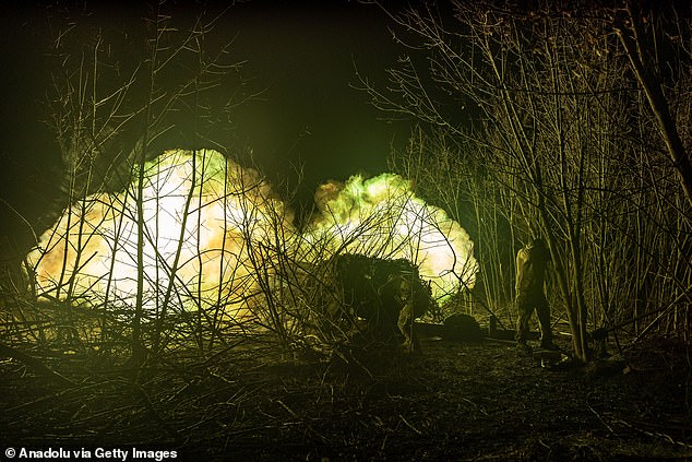 Ukrainian soldiers fire artillery at their fighting position towards Bakhmut, Ukraine, on November 18