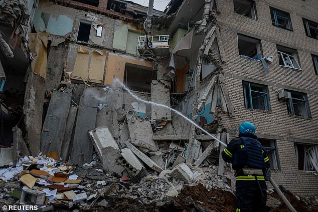 Rescuer works at the side of a hospital that was heavily damaged by a Russian missile attack, amid the Russian attack on Ukraine, in the city of Selydove, Donetsk region, Ukraine, Tuesday