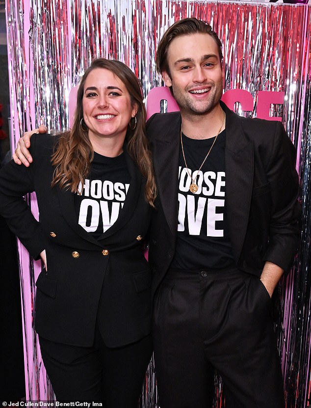 Beaming: Douglas put his arm around Josie as he spent the evening supporting the charity