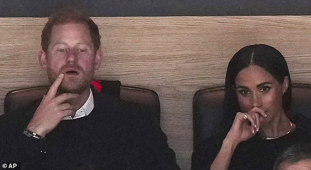 The Duke and Duchess of Sussex appeared focused as they watched the first period of the match