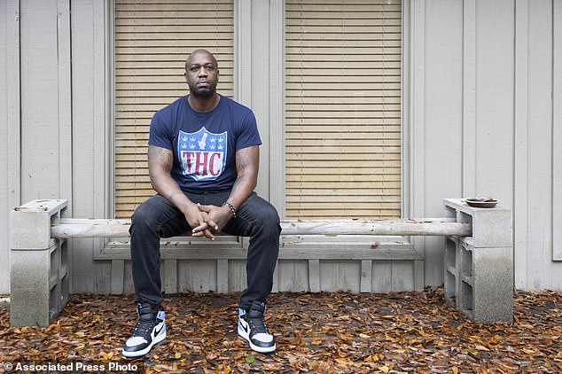 Williams poses for a photo outside his home in Picayune, Mississippi as he tells his story