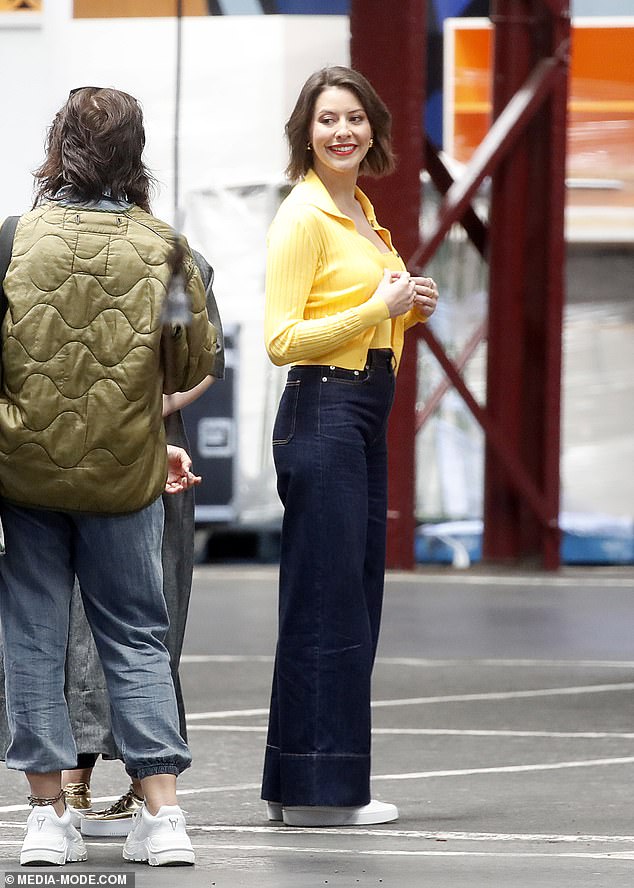 Food critic Sofia Levin showed up in a canary yellow top and cardigan combo