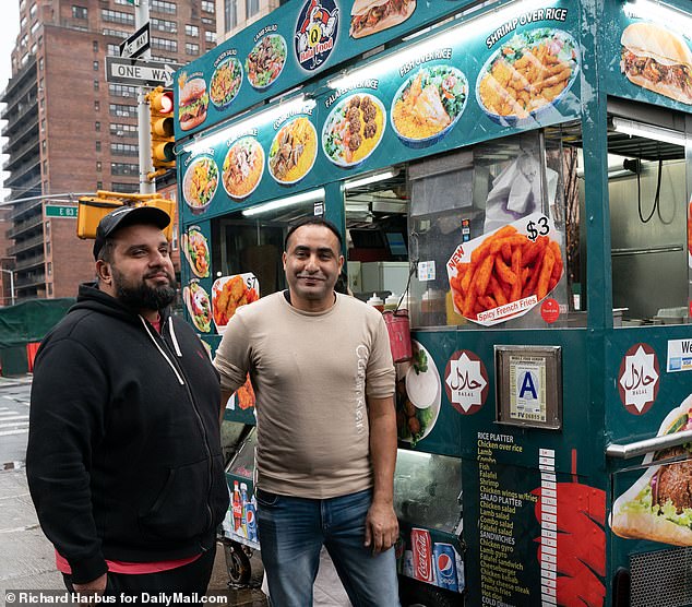 Cart owner Islam Mustafa, left in black, told DailyMail.com how Seldowitz started harassing his staff a week ago.  He is shown with Ahmed Mohian (right), his business partner