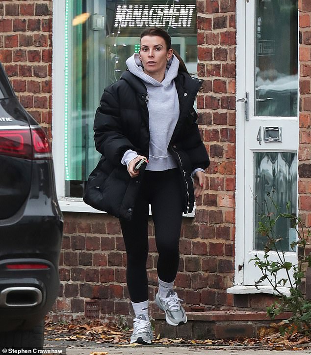 Sporty: The WAG, who cut a casual figure for the outing as she donned black gym leggings and a gray hoodie underneath the jacket