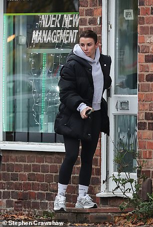 Stylish: She felt comfortable in a pair of white New Balance sneakers, paired with a pair of long white Adanola socks