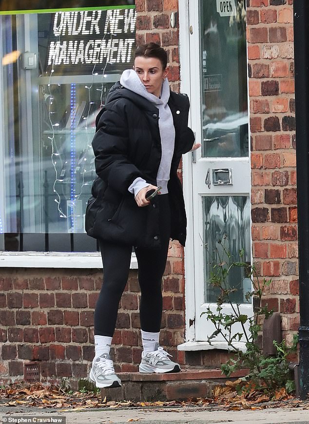 Looking good: Coleen pulled her long brunette locks back into a ponytail and accessorized the daytime outfit with a pair of tiny silver hoop earrings