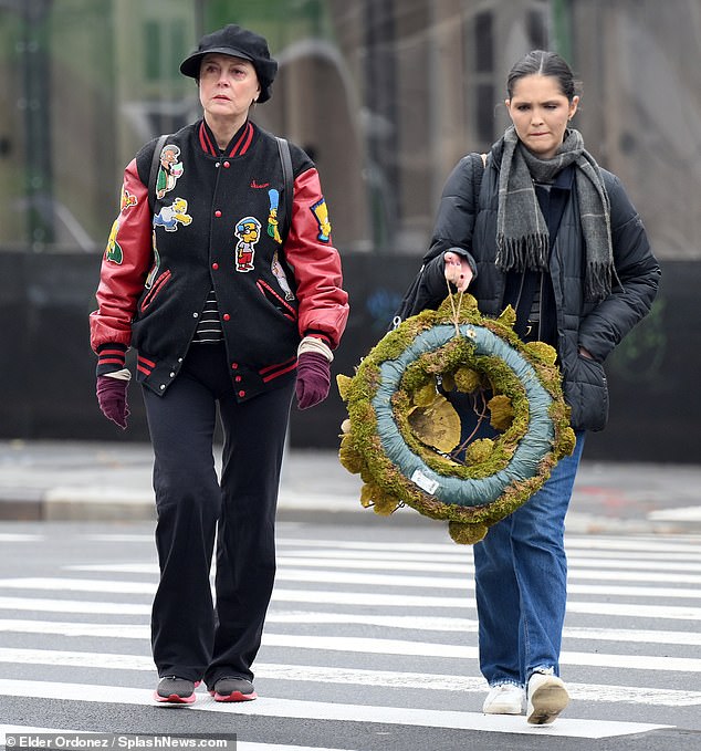 Sarandon and her companion wore a festive wreath as they walked through the city